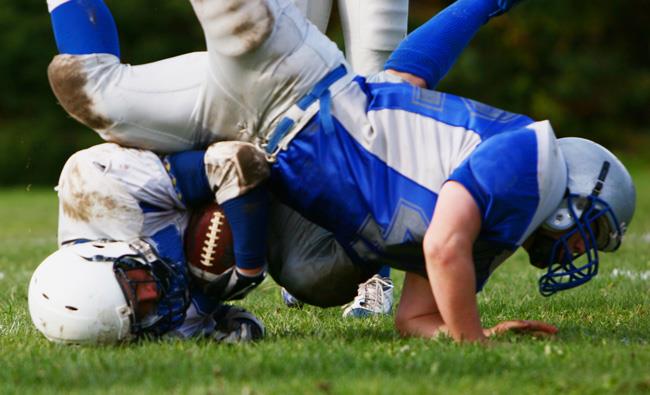 hard football tackles can cause concussions